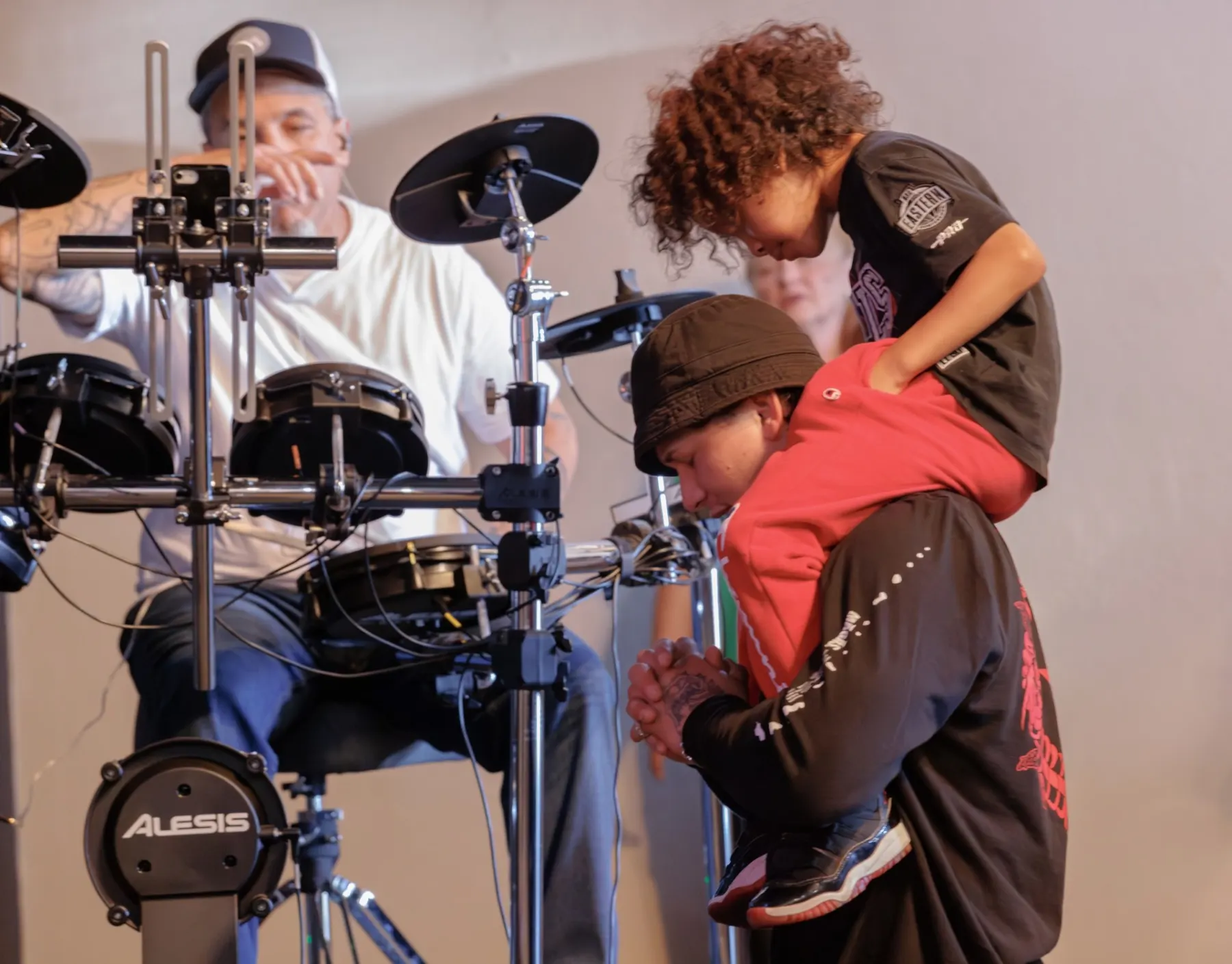 A child being prayed for during worship at River Northwest