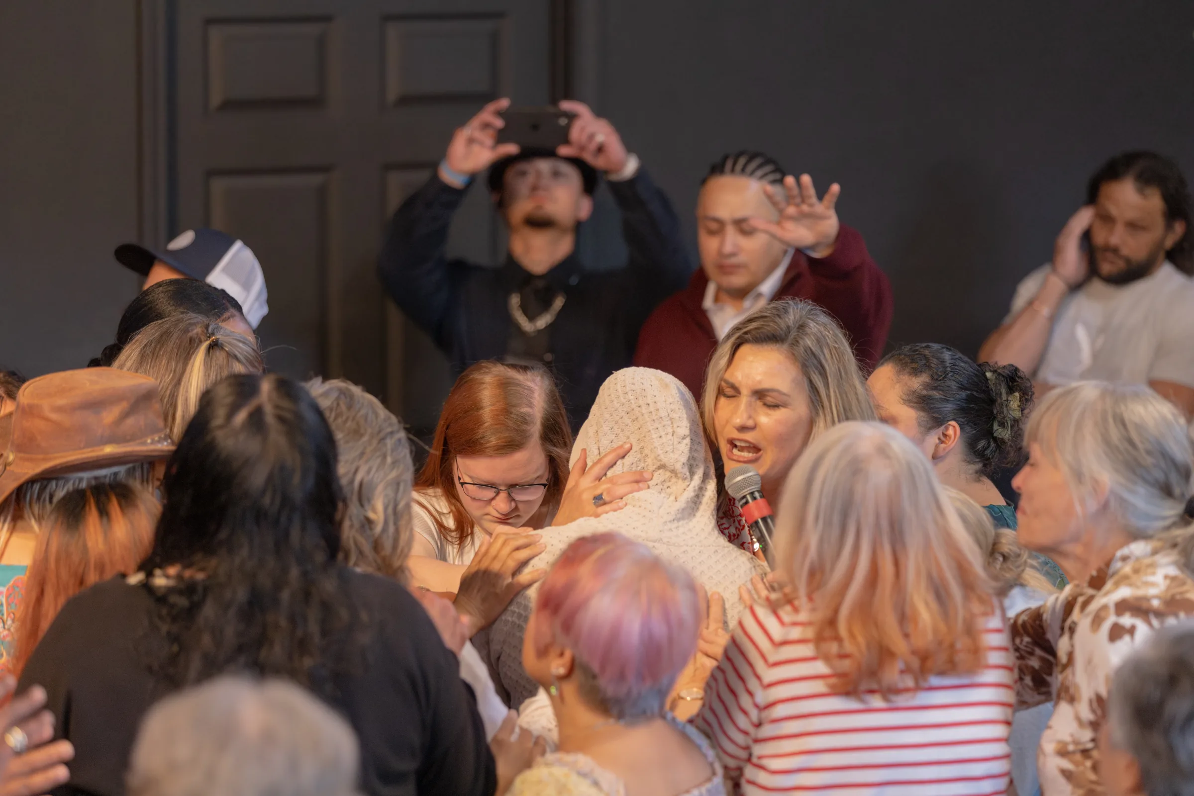Women gathered in prayer at River Northwest Church