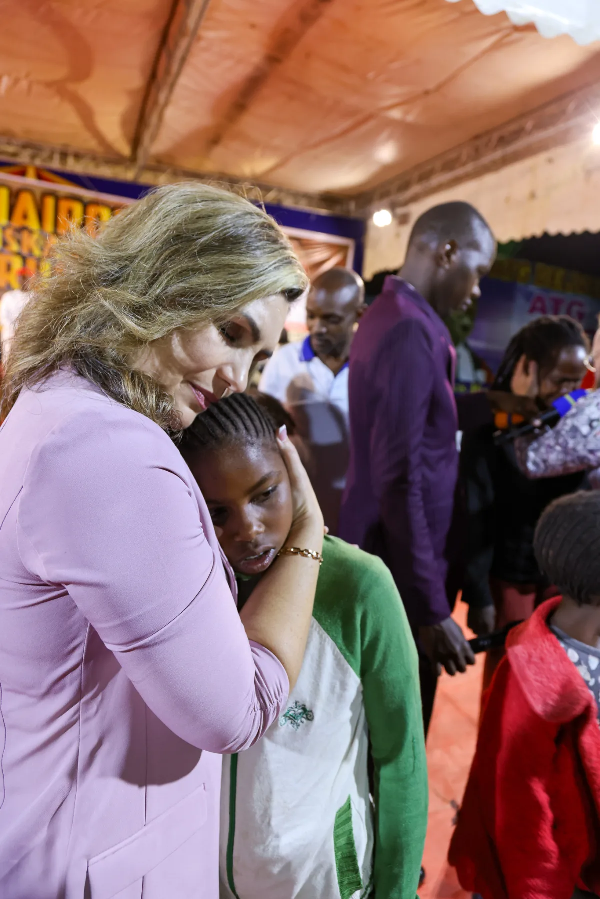 Pastor Hannah caring for a child during ministry