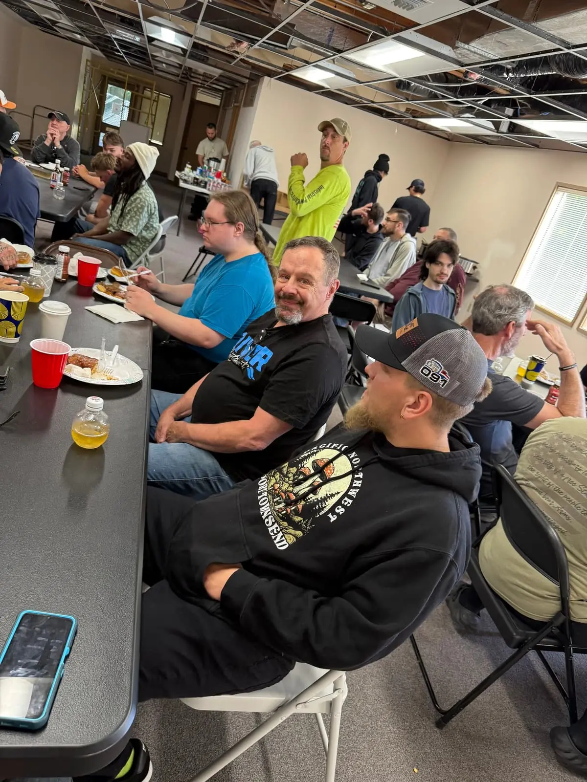 Men gathered around tables for a Men's Ministry breakfast