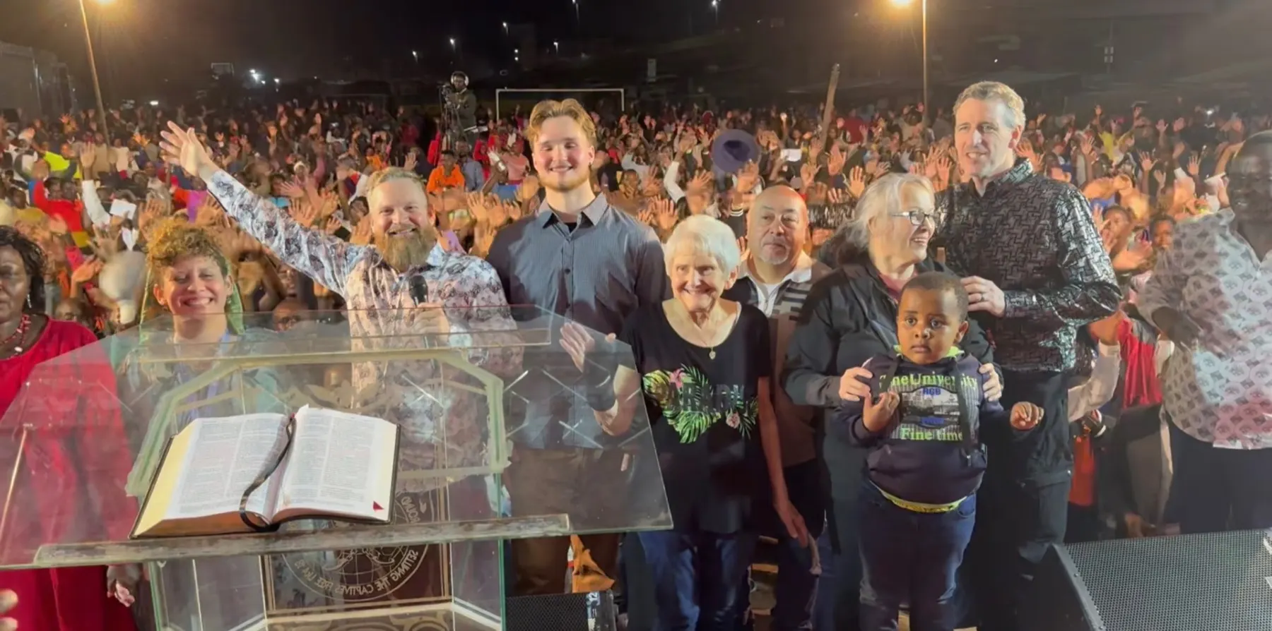 River Northwest mission team standing before a large gathering