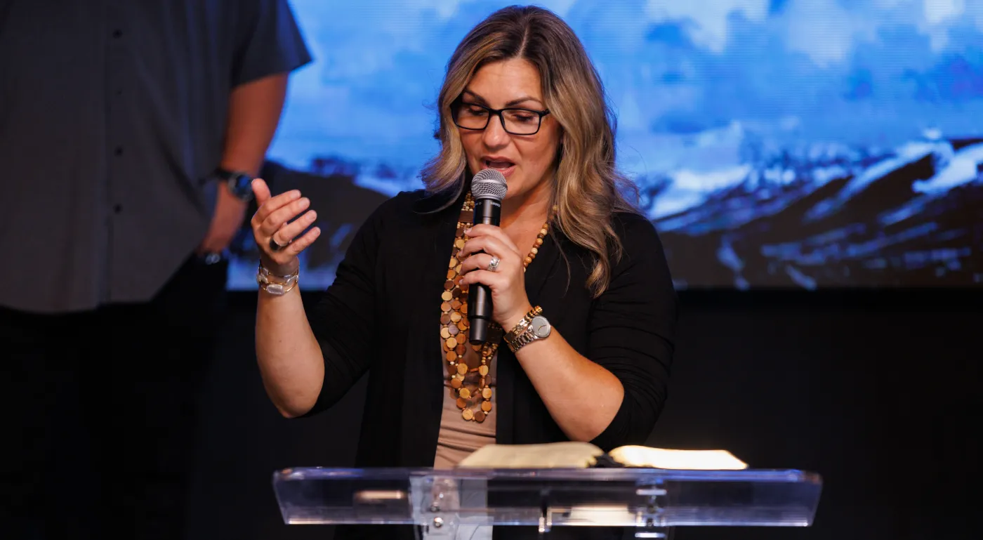 Pastor Hannah teaching from the Bible at River Northwest Church