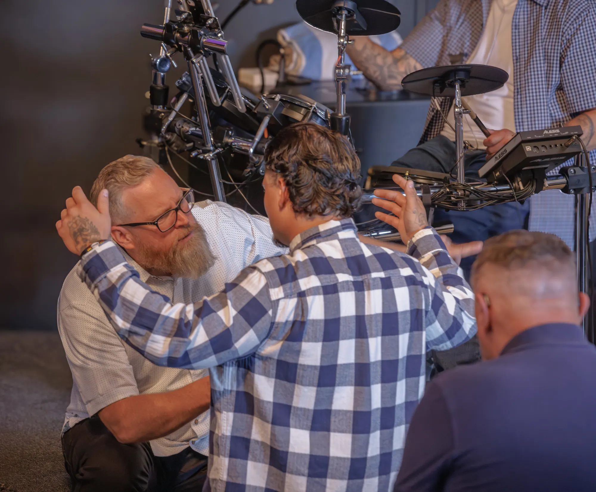 Pastor Jason praying with someone at River Northwest Church