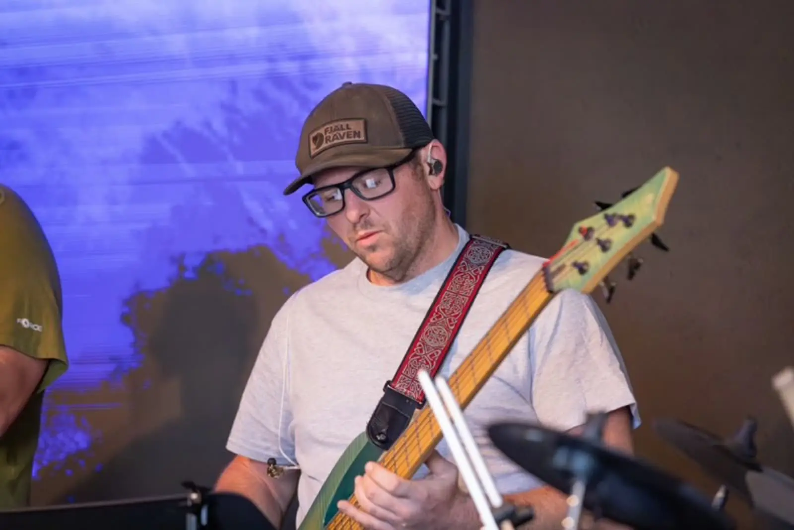 Bass player serving during worship